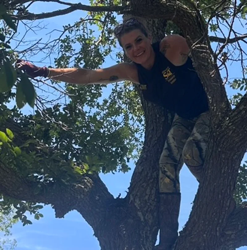 Assisting a horse rescue with storm and tree debris Brit enjoying climbing a tree