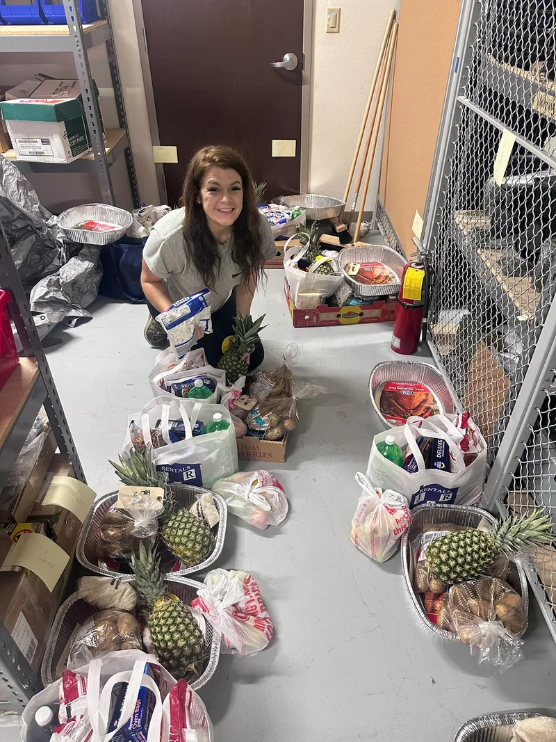 Brit sorting and organizing thanksgiving meals for mil families